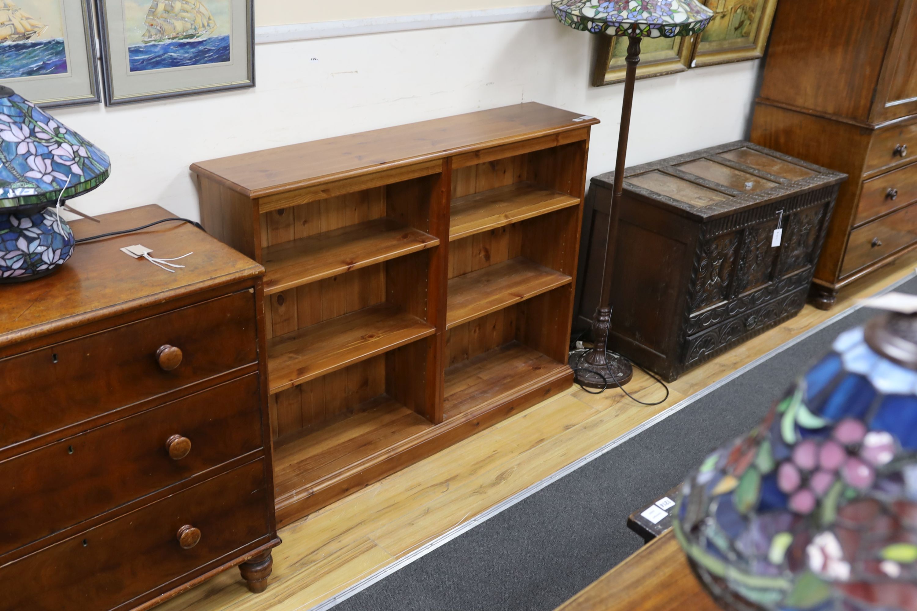 A modern pine open fronted bookcase, length 130cm, depth 29cm, height 100cm